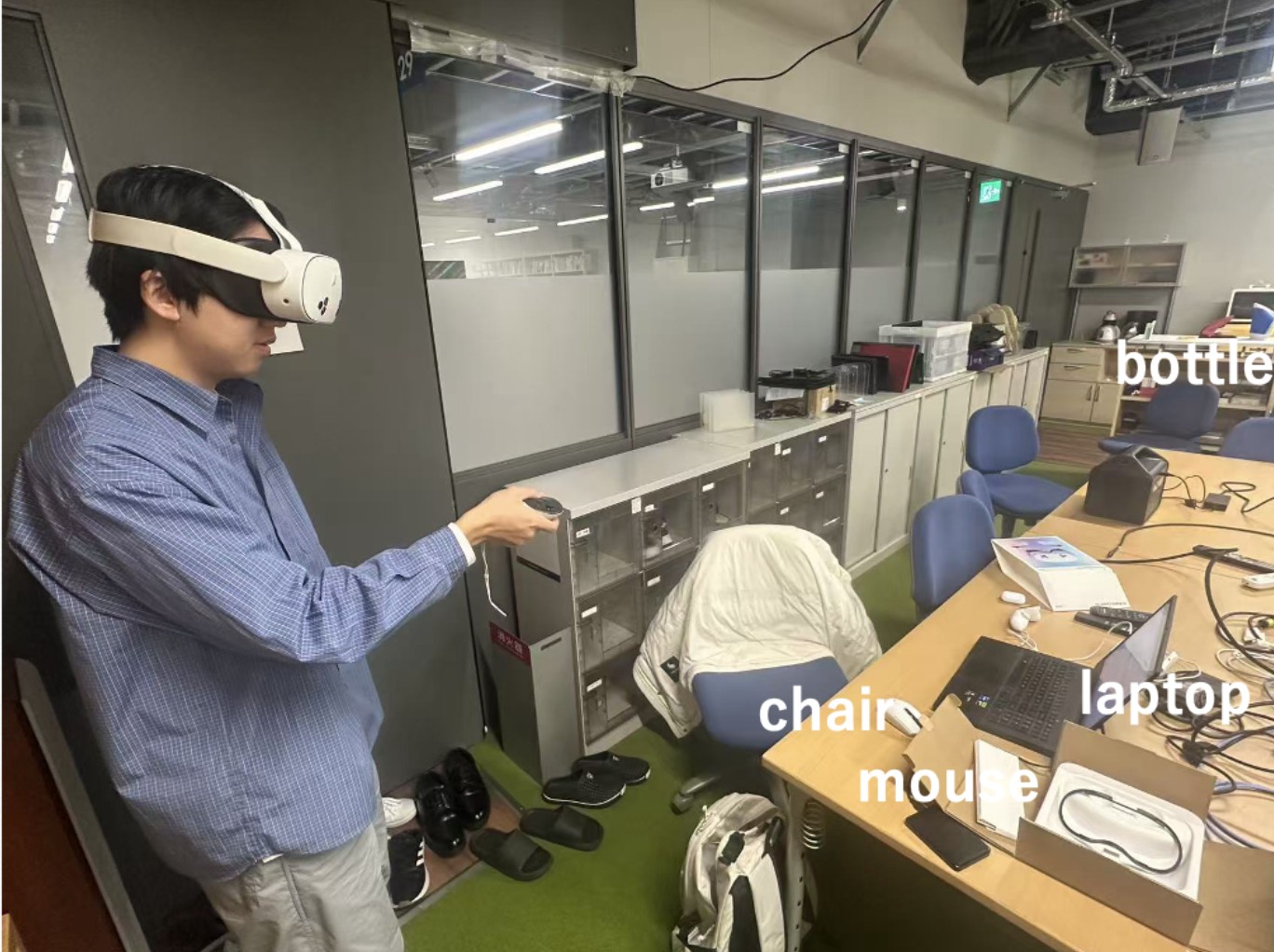 Zhaoyang Yuan wearing a mixed-reality headset and holding a controller during the experiment