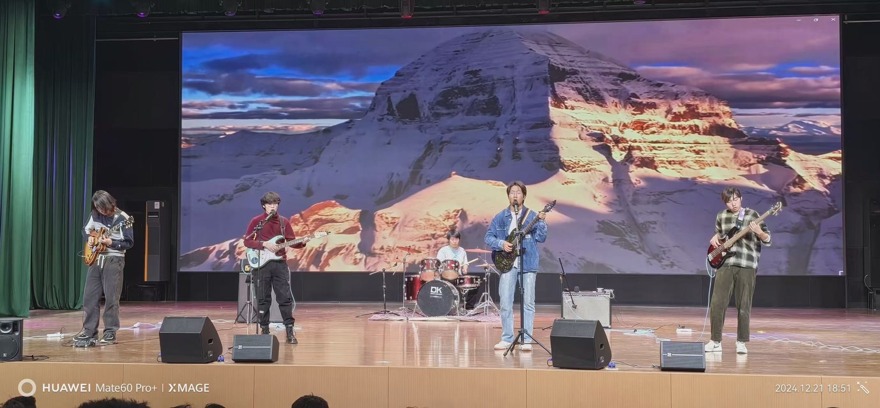 The members of null phase performing together on stage